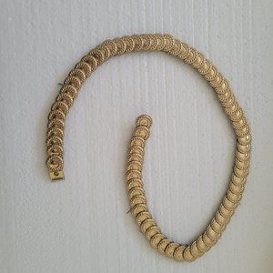 Expandable metal serpentine belt